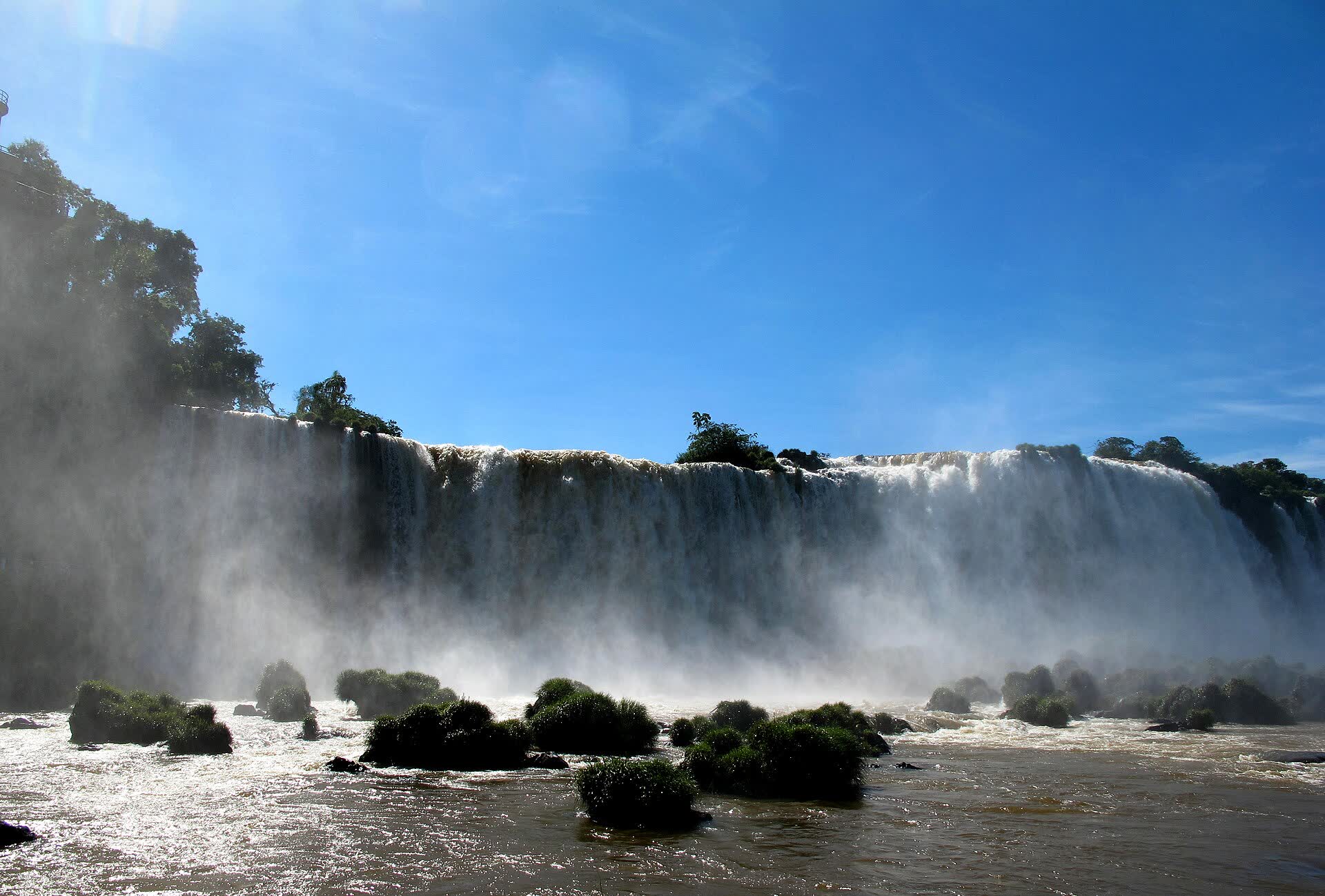 Iguazu Falls under a blue sky